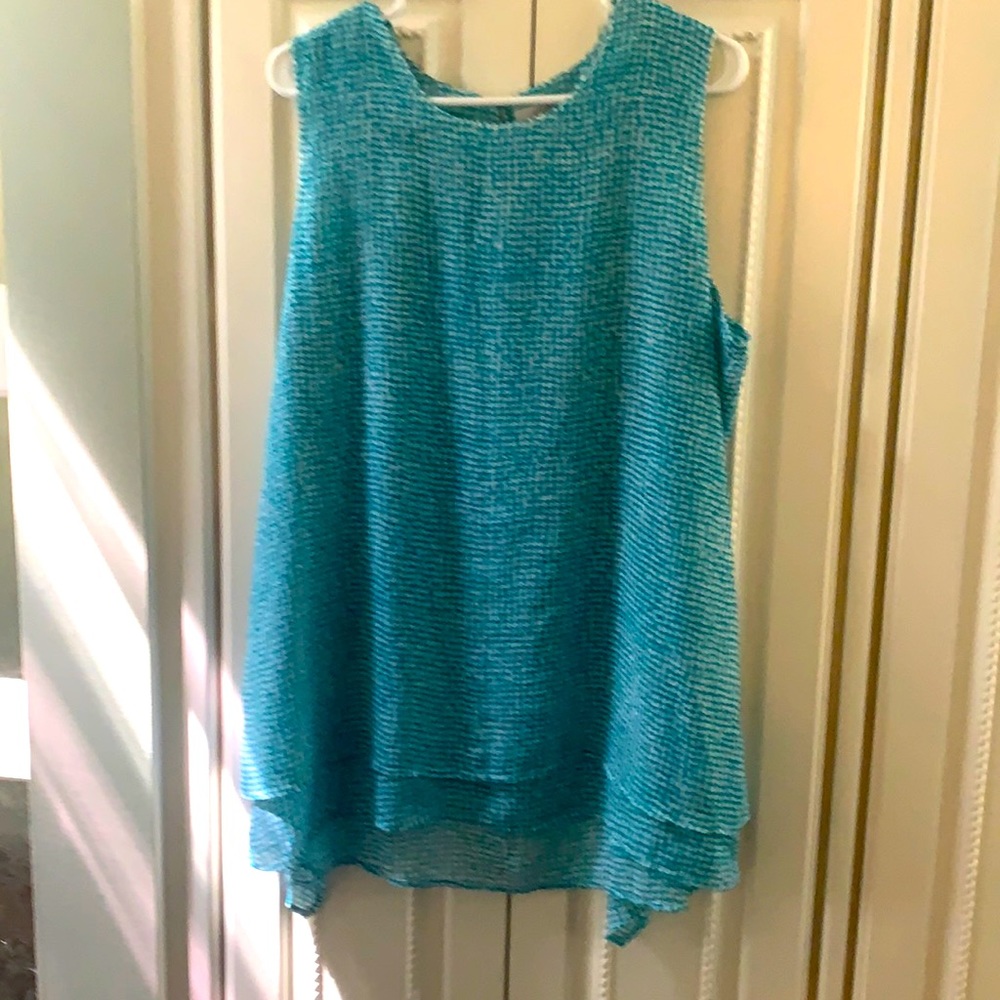 Sleeveless top rarely worn!!